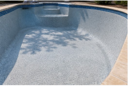 Freshly replastered pool interior with a smooth new finish